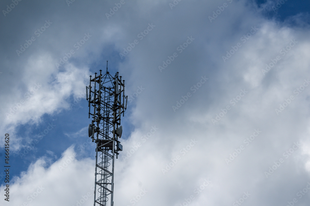 Cellphone tower with clouds in the background