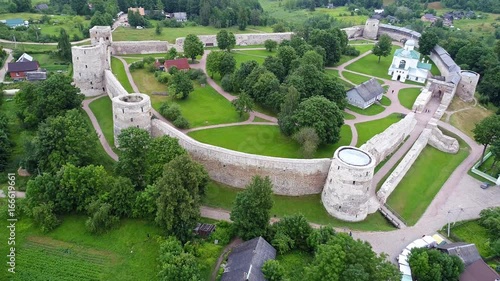 Ancient fortress Izborsk. Drone flight over old medieval stronghold in Izborsk. photo