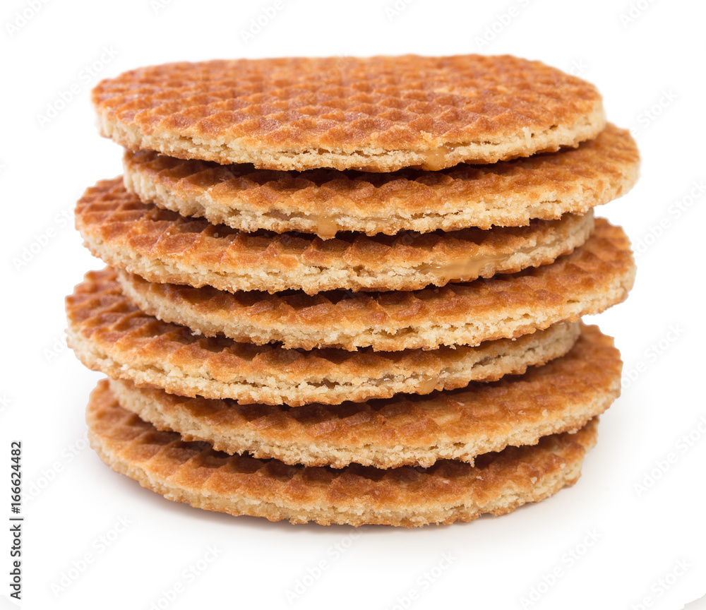 Pile of round dutch waffles with caramel isolated on white background. Pile of round dutch waffles with caramel isolated on white background.