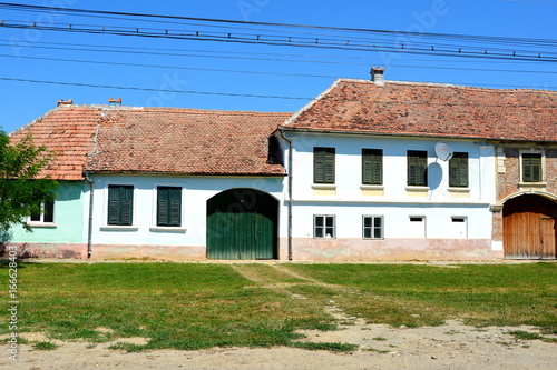 Typical houses in the village Merghindeal-Mergenthal, Transylvania, Romania.The settlement was for the first time certified in 1336 photo