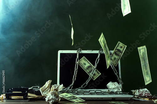Dollars laptop on your desktop