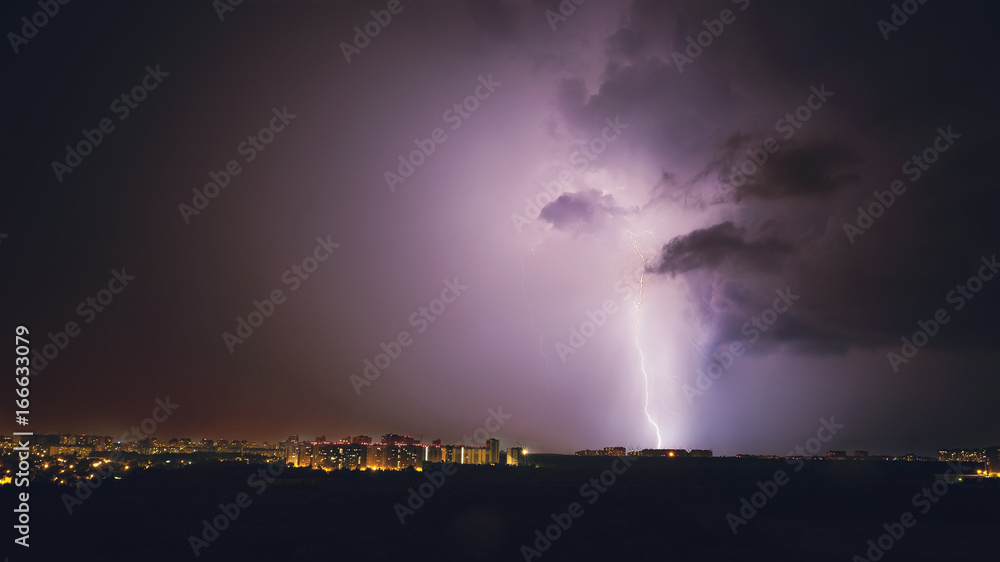 Lightning storm in purple tones in night