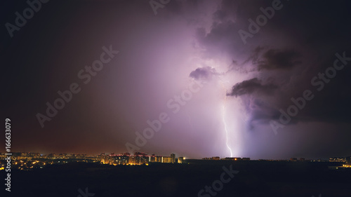 Lightning storm in purple tones in night