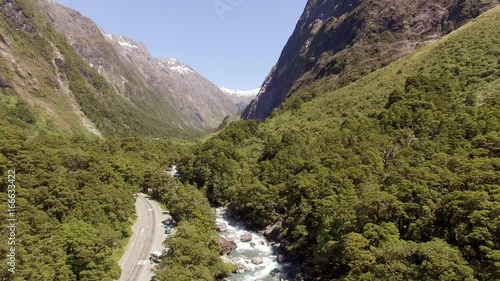 New Zealand ,south island in National Park wild fresh river flows, aerial shot , camera descending photo