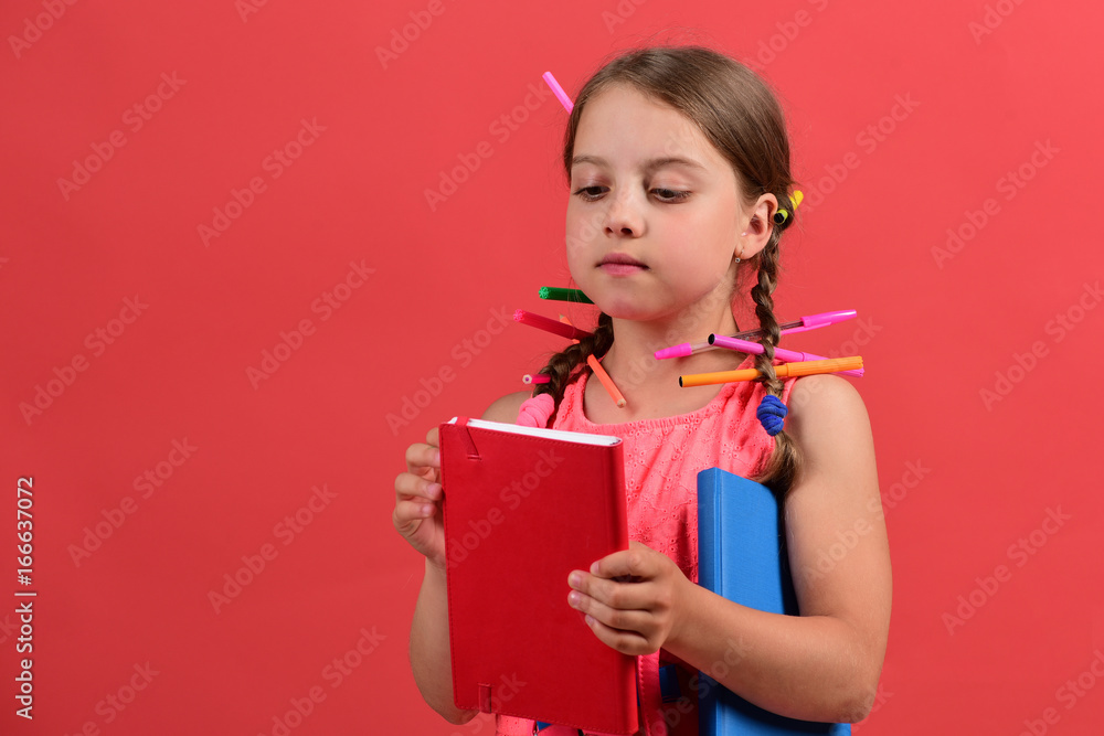 Back to school and art concept. Pupil in pink dress Back to school and art concept. Pupil in pink dress
