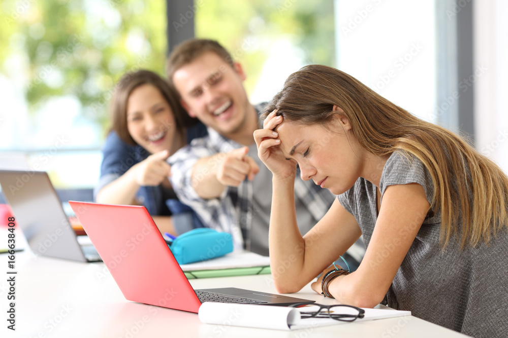 Classmates bullying a sad victim Classmates bullying a sad victim