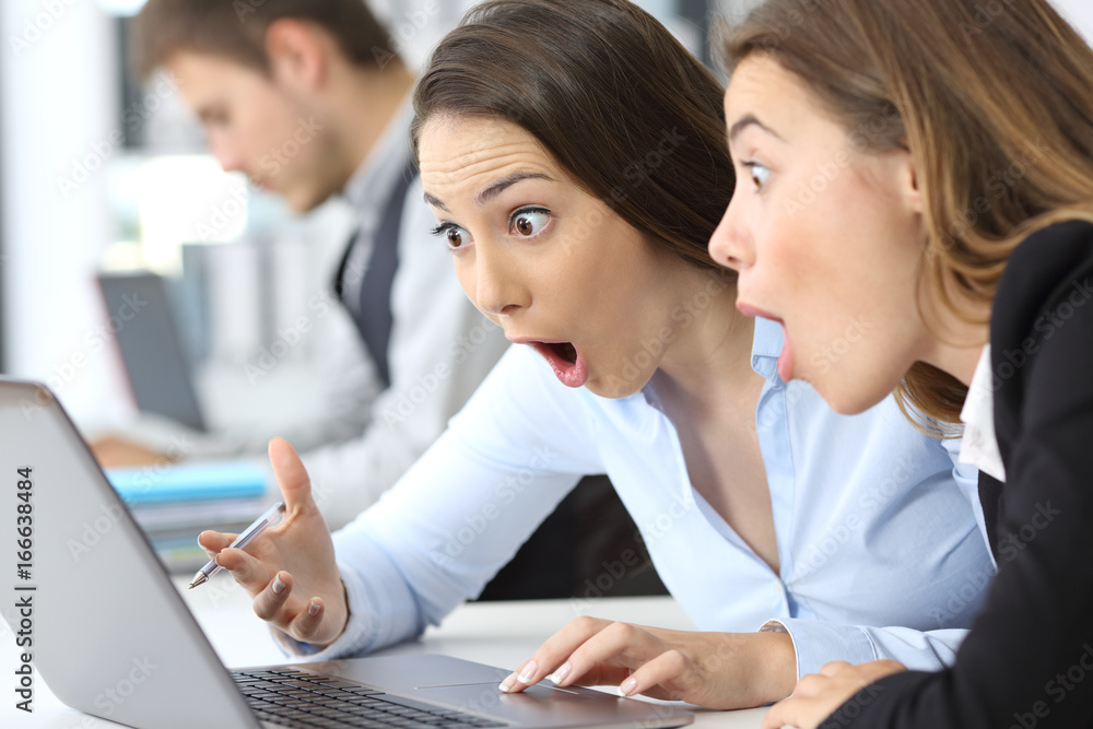 Two amazed businesswomen finding on line content Two amazed businesswomen finding on line content