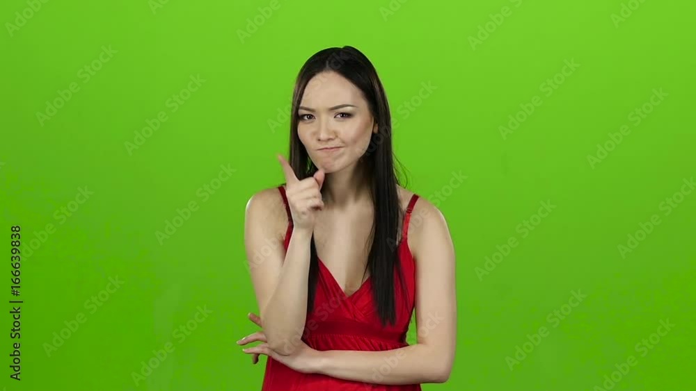 Asian thought about the meaning of life, pensive and focused. Green screen. Slow motion Asian thought about the meaning of life, pensive and focused. Green screen. Slow motion