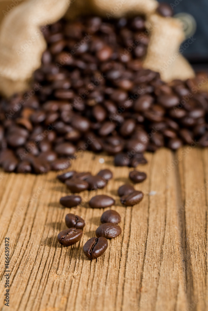 coffee bean and saccloth on wood table coffee bean and saccloth on wood table
