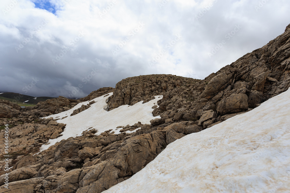 Fototapeta premium Mountain slopes covered by snow