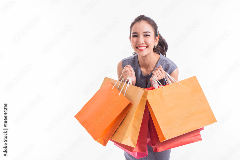 Happy Asian woman smile with shopping bags,Isolated on white background Happy Asian woman smile with shopping bags,Isolated on white background