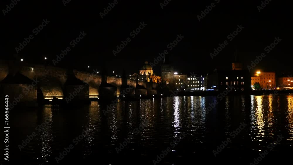 Vltava River through Prague cityscape, night Vltava River through Prague cityscape, night