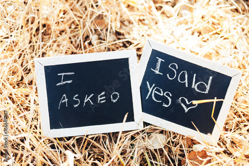 Black chalkboard with sign I asked, I said yes. Proposal. Engagement photo