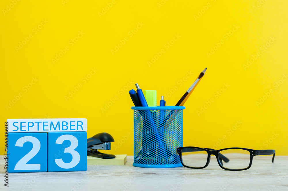 23rd September. Image of september 23, calendar on yellow background with office supplies. Fall, autumn time 23rd September. Image of september 23, calendar on yellow background with office supplies. Fall, autumn time
