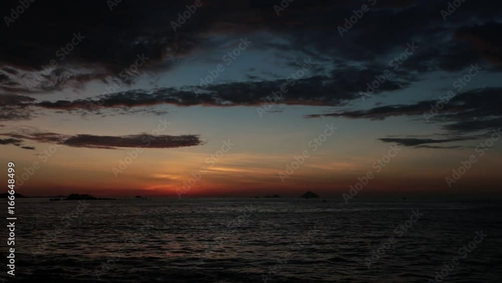 Sunrise sky fishing boats and a tropical island at dawn looking out over the south China sea in Vietnam. High definition time lapse stock footage. Sunrise sky fishing boats and a tropical island at dawn looking out over the south China sea in Vietnam. High definition time lapse stock footage.