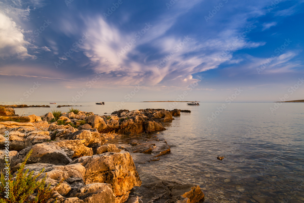 Beautiful scenery on the Adriatic Sea Coast, in summer, with storm clouds, at sunset