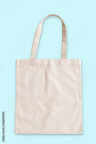 Tote bag fabric cloth shopping sack mockup isolated on blue background (clipping path)