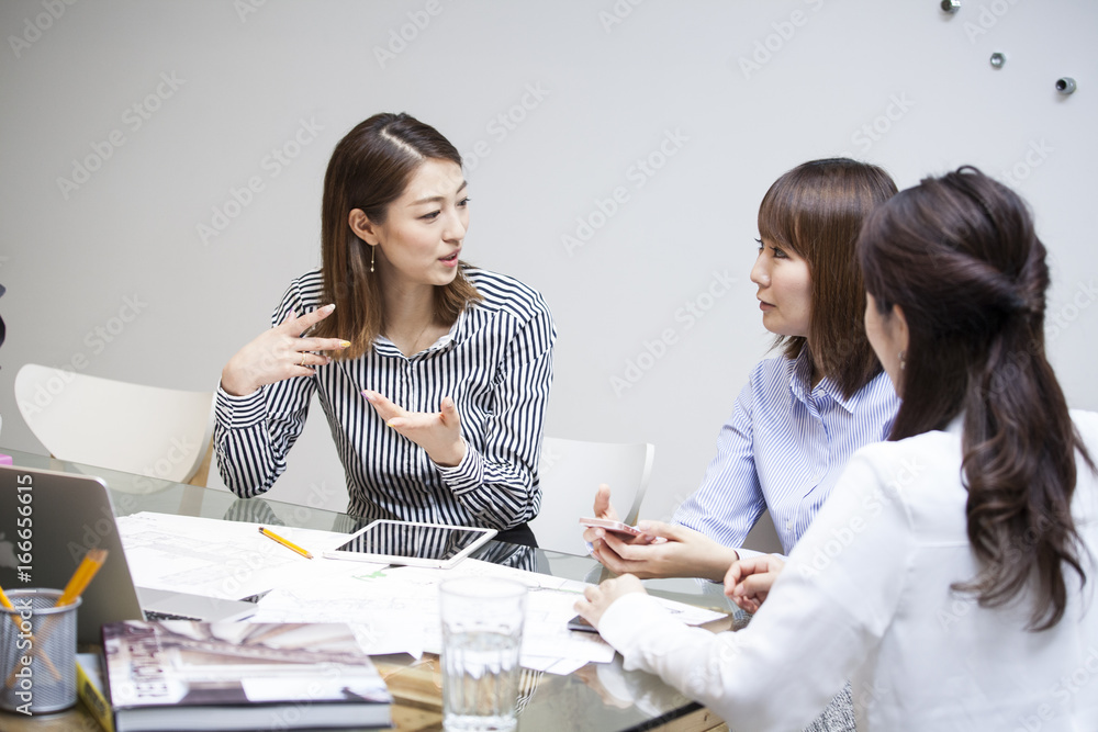 Three women are having meetings at a trendy office Three women are having meetings at a trendy office