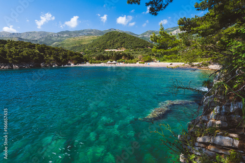 Fototapeta Naklejka Na Ścianę i Meble -  Lucice beach near Petrovac, Montenegro. Lucice landscape- sandy beach on Montenegrin coast with clear water and pine trees around.
