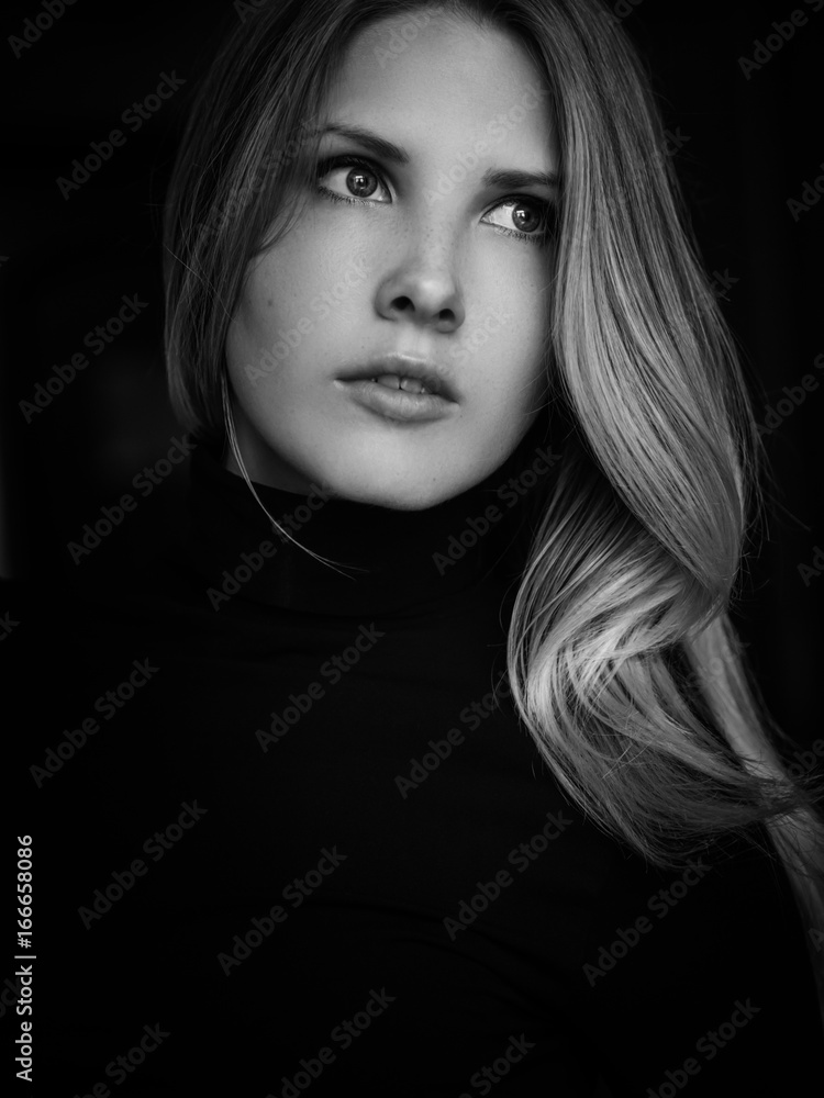 Black and white portrait of beautiful young woman. Selective soft focus.