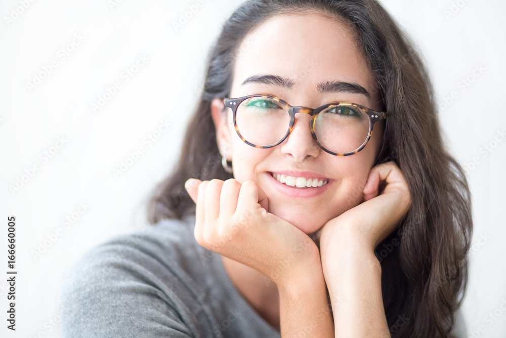 Φωτογραφία Smiling face of teenage girl wearing eyeglasses