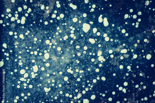 Abstract space background with white blur dots for design.