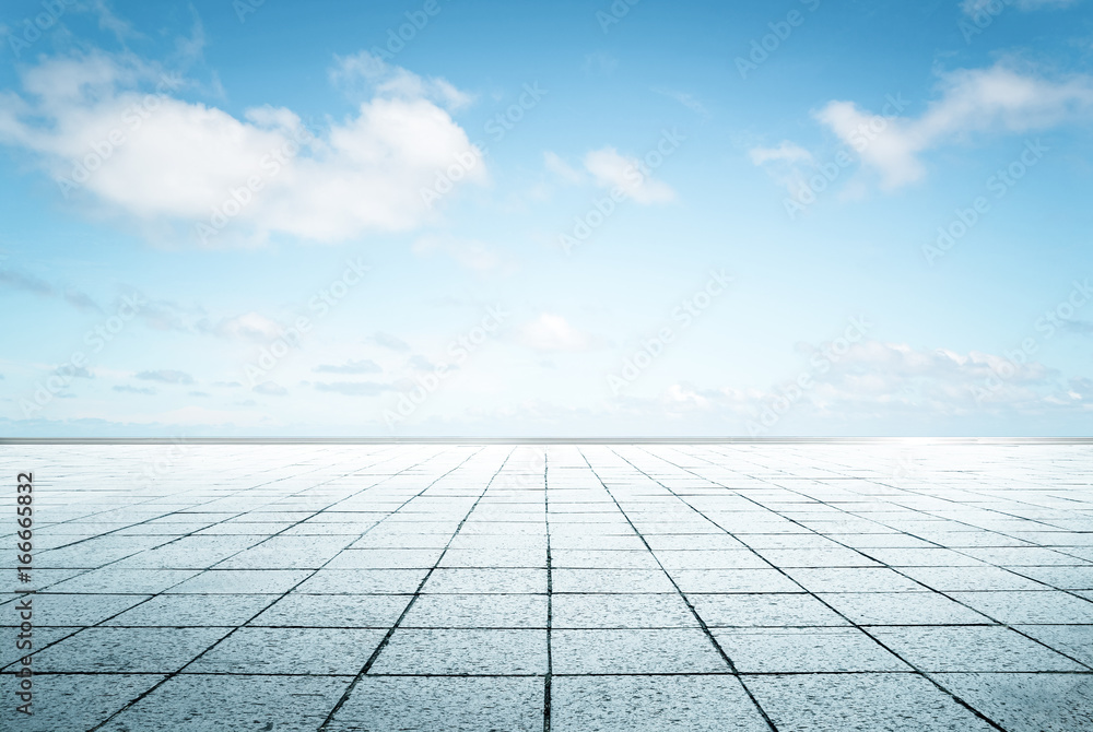 Empty  floor in front of blue sky .
