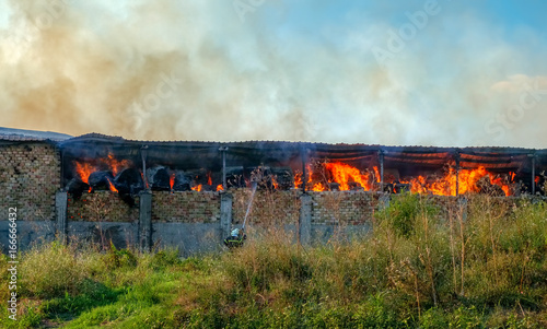 Fire on barn with straw photo