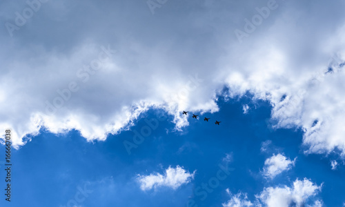 Military aircraft in the blue sky