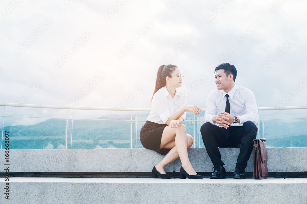 Asian Business people talking outside office after work Asian Business people talking outside office after work