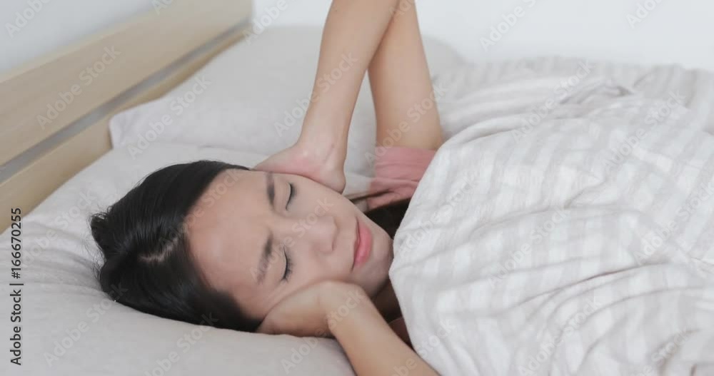 Woman suffer from noisy one bed Woman suffer from noisy one bed