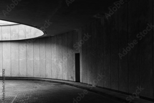 Tunnel with a single door in black and white colors. 