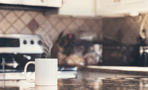 White coffee mug in modern kitchen interior