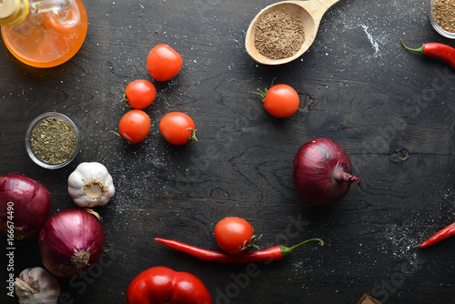 Big set organic food. Fresh raw vegetables. On a black chalkboard.