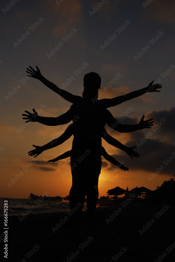 Silhouette of one body with lot of hands. Happy family play on summer vacation