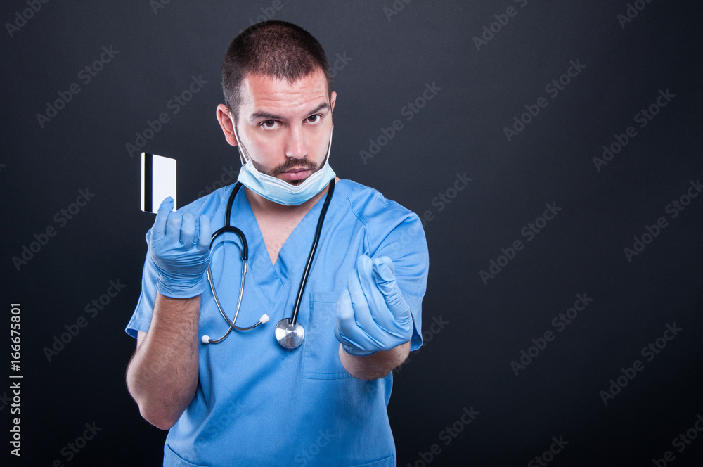 Doctor holding card making money gesture Doctor holding card making money gesture