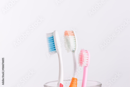 Old Toothbrush  in glass on white