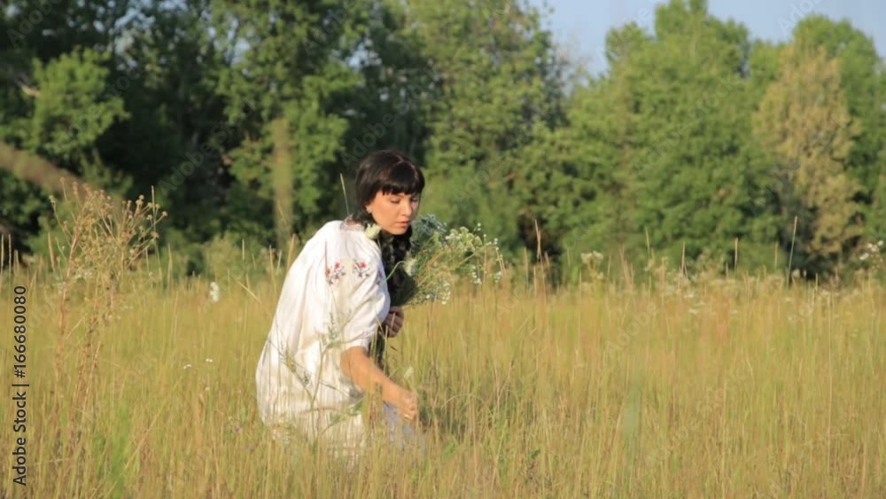 Girl making flower circlet in the meadow at sunset in nature. Girl making flower circlet in the meadow at sunset in nature.