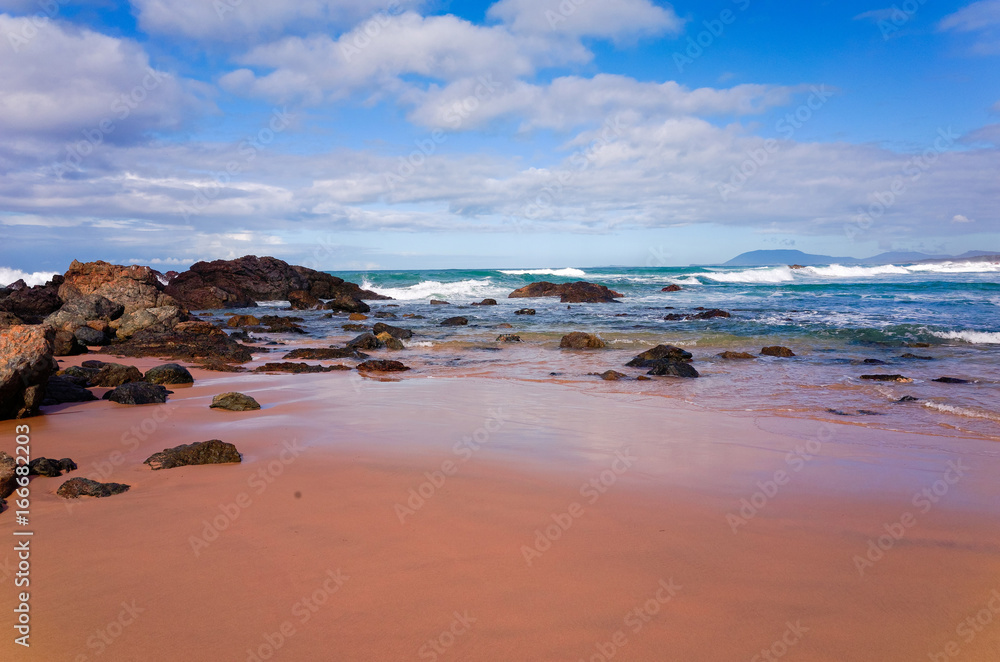 Rocks on sandy beach at Port Macquarie Australia