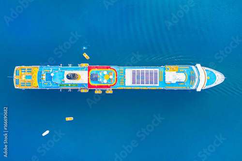 Top view of a colorful cruise liner in the blue sea