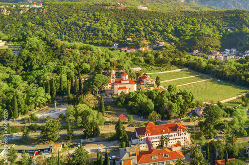 View from above to old European resort town with a monastery