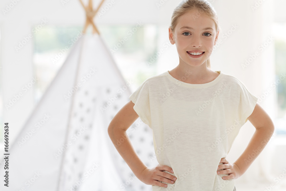 Pretty female youngster in casual posing for camera Pretty female youngster in casual posing for camera
