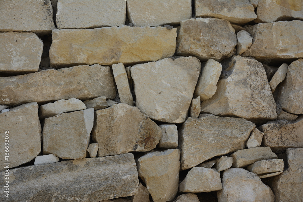 Wall of old stones with cracks texture background Wall of old stones with cracks texture background