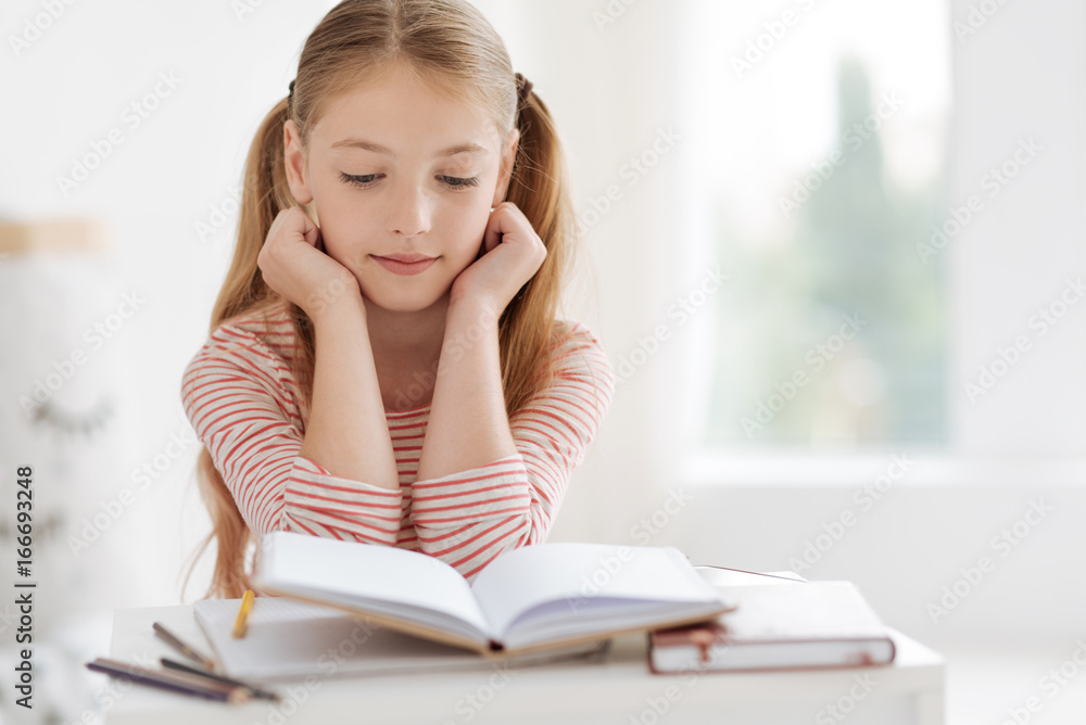 Smart female pupil doing homework Smart female pupil doing homework