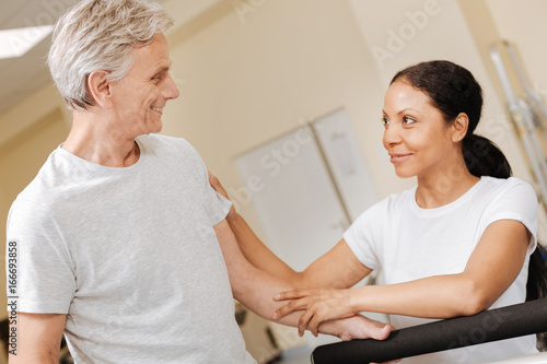 Profile photo of mature man that looking at his trainer