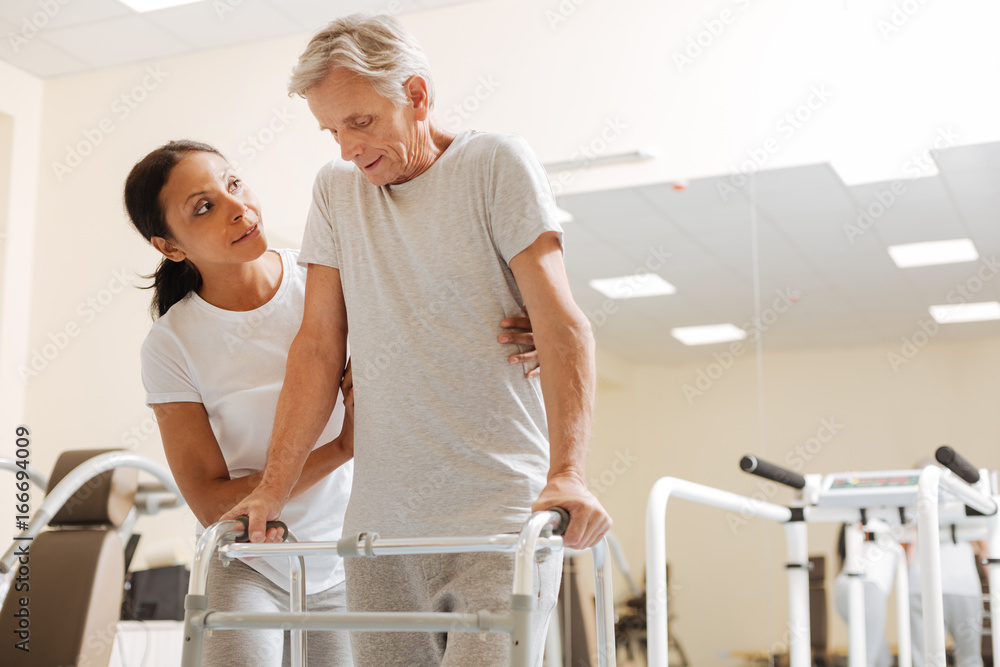 Concentrated man leaning on support Concentrated man leaning on support