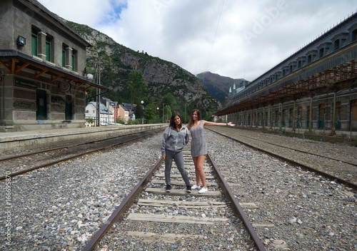 Dos amigas en las vías de la estación de Canfranc photo