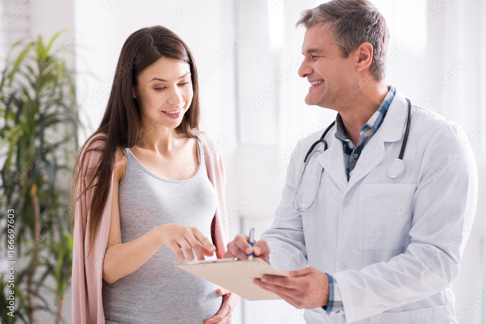 Attentive pregnancy pointing at prescription Attentive pregnancy pointing at prescription