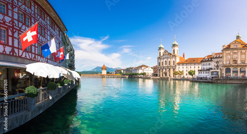 Panoramic view of historic Zurich city center with famous Fraumunster, Grossmunster and St. Peter and river Limmat at Lake Zurich on a sunny day with clouds in summer, Canton of Zurich, Switzerland photo