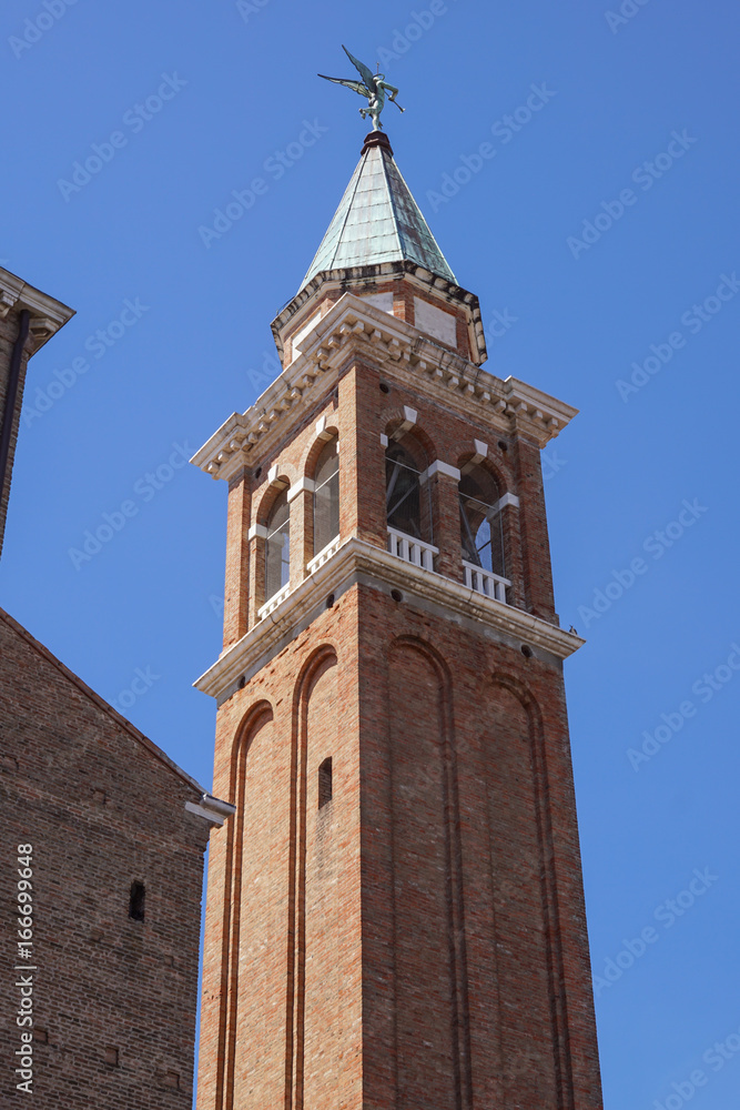 Bell tower near cathedral dedicated to St. Mary of the Assumption in Chioggia